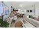 Spacious living area with a blend of modern furniture and natural light flowing throughout the open space at 1065 Splash Shot Pl # 1801, Davenport, FL 33896