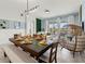 Bright living room and dining area with modern furnishings and an open floor plan at 1065 Splash Shot Pl # 1801, Davenport, FL 33896
