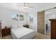 Spacious bedroom with a wooden sliding barn door and a double bed at 36 Camellia Dr, Ormond Beach, FL 32176