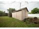 Tan block detached garage in the backyard at 806 Florida Ave, Saint Cloud, FL 34769