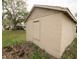 Tan block detached garage in the backyard at 806 Florida Ave, Saint Cloud, FL 34769