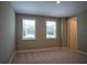 Bright bedroom with two windows and neutral carpeting at 1676 Andover Ridge Dr, Deland, FL 32720