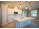 Spacious kitchen with white cabinets, large island, and stainless steel appliances at 1676 Andover Ridge Dr, Deland, FL 32720