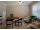 Home office with hardwood floors, built-in desk, and comfortable seating at 1676 Andover Ridge Dr, Deland, FL 32720