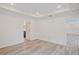 Large bedroom with hardwood floors and access to hallway at 1677 Andover Ridge Dr, Deland, FL 32720