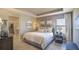 Spacious bedroom with a comfortable bed and access to a walk-in closet at 1677 Andover Ridge Dr, Deland, FL 32720