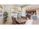 Elegant dining room with a long wooden table and stylish decor at 1677 Andover Ridge Dr, Deland, FL 32720
