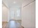 Bright entryway with hardwood floors and built-in storage at 1677 Andover Ridge Dr, Deland, FL 32720