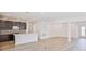 Open concept kitchen features an island and light-colored cabinetry at 1677 Andover Ridge Dr, Deland, FL 32720