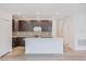 Modern kitchen with an island and mosaic backsplash at 1677 Andover Ridge Dr, Deland, FL 32720