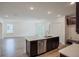 Modern kitchen with island, stainless steel appliances, and dark cabinetry at 1677 Andover Ridge Dr, Deland, FL 32720