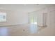 Living room with hardwood floors, sliding doors, and natural light at 1677 Andover Ridge Dr, Deland, FL 32720