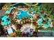 Aerial view of the waterpark, including the pools, slides, and lazy river with plenty of chairs and umbrellas at 14501 Grove Resort Ave # 1105, Winter Garden, FL 34787