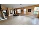 Bright dining room with tile floors and a view of the staircase at 143 Tigerlily Ct, Davenport, FL 33837