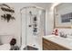 Modern bathroom featuring a glass-enclosed shower, and a wooden vanity at 1817 W Grant St, Orlando, FL 32805
