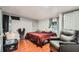 Bedroom featuring a window, closet, and a comfortable chair for relaxing at 1817 W Grant St, Orlando, FL 32805