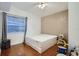 Bedroom with a neutral color scheme, hardwood floors, a window, and a ceiling fan at 1817 W Grant St, Orlando, FL 32805