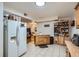 Well-lit kitchen with tile floors, a center island, ample cabinet space, and a view into the living room at 1817 W Grant St, Orlando, FL 32805
