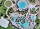 Overhead shot of luxurious resort-style pools and recreation area at 8895 Cabot Cliffs Dr # 103, Davenport, FL 33896