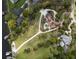 Aerial view of a home with a large yard, pool, and waterfront access at 208 Green Lake Cir, Longwood, FL 32779