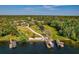 Aerial view of waterfront property highlighting its expansive lot, dock, boat house and lake access at 208 Green Lake Cir, Longwood, FL 32779
