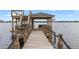 View of the outdoor wooden dock with gazebo and stairs that lead to an upper deck overlooking the water at 208 Green Lake Cir, Longwood, FL 32779