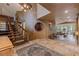 Elegant foyer with a grand staircase, travertine floors, and unique architectural details and lighting at 208 Green Lake Cir, Longwood, FL 32779