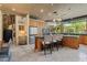 Bright eat-in kitchen with stainless steel appliances, granite countertops, and views of the beautifully landscaped yard at 208 Green Lake Cir, Longwood, FL 32779