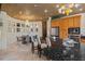 Kitchen with granite counters, stainless appliances, an island, and a breakfast bar with great natural light at 208 Green Lake Cir, Longwood, FL 32779