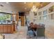 Open kitchen features granite counters, an island with seating, an adjacent dining area, and great natural light at 208 Green Lake Cir, Longwood, FL 32779