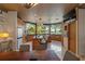 Open kitchen and dining area offers granite countertops, island seating, lake views, and premium appliances at 208 Green Lake Cir, Longwood, FL 32779