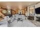 Large, open living room featuring stone floors, neutral color palette, and ample seating at 208 Green Lake Cir, Longwood, FL 32779