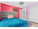 Vibrant bedroom with a comfortable bed and colorful decor at 39250 Forest Dr, Eustis, FL 32736