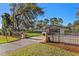 House exterior features a gated entrance and a well manicured lawn at 39250 Forest Dr, Eustis, FL 32736