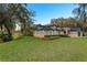 Two-story house with stone accents and manicured lawn at 39250 Forest Dr, Eustis, FL 32736