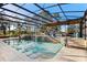 Resort-style pool with a covered patio and a basketball hoop at 39250 Forest Dr, Eustis, FL 32736