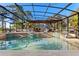 Stunning pool area with a covered patio and spa at 39250 Forest Dr, Eustis, FL 32736