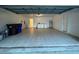 A spacious, tiled garage with laundry hookups, a service door, and ample storage at 608 Abaco Ct, Kissimmee, FL 34746