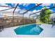 Sparkling screened-in pool with a white concrete deck, perfect for outdoor relaxation at 608 Abaco Ct, Kissimmee, FL 34746