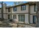 Backyard view of the house, featuring sliding glass doors and an AC unit at 4945 Sanoma Vlg # B, Orlando, FL 32808