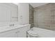 Bathroom features a modern vanity and subway tile in shower at 4945 Sanoma Vlg # B, Orlando, FL 32808