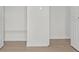 Bedroom featuring plank flooring with white painted trim at 4945 Sanoma Vlg # B, Orlando, FL 32808