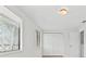 Bedroom featuring bright natural light, double closets, and neutral walls and flooring at 4945 Sanoma Vlg # B, Orlando, FL 32808