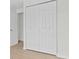 Bedroom featuring closet with folding doors and plank flooring at 4945 Sanoma Vlg # B, Orlando, FL 32808