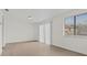 Bright bedroom with vinyl flooring and large window with vertical blinds at 4945 Sanoma Vlg # B, Orlando, FL 32808