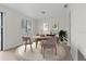 Cozy dining room with stylish round table, seating for four, and modern decor at 4945 Sanoma Vlg # B, Orlando, FL 32808