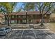 Charming townhome with mature trees, brick accents, and visitor parking at 4945 Sanoma Vlg # B, Orlando, FL 32808