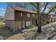 Inviting exterior featuring a townhome with neat landscaping and a natural tree providing shade at 4945 Sanoma Vlg # B, Orlando, FL 32808