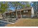 Exterior view of townhomes with well-maintained lawns and mature trees at 4945 Sanoma Vlg # B, Orlando, FL 32808
