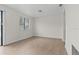 Large living room with wood-style flooring, lots of light and neutral walls at 4945 Sanoma Vlg # B, Orlando, FL 32808